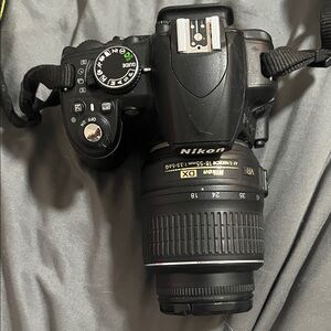Nikon Black DSLR 3100 with DX SWM Aspherical Versatile Lens